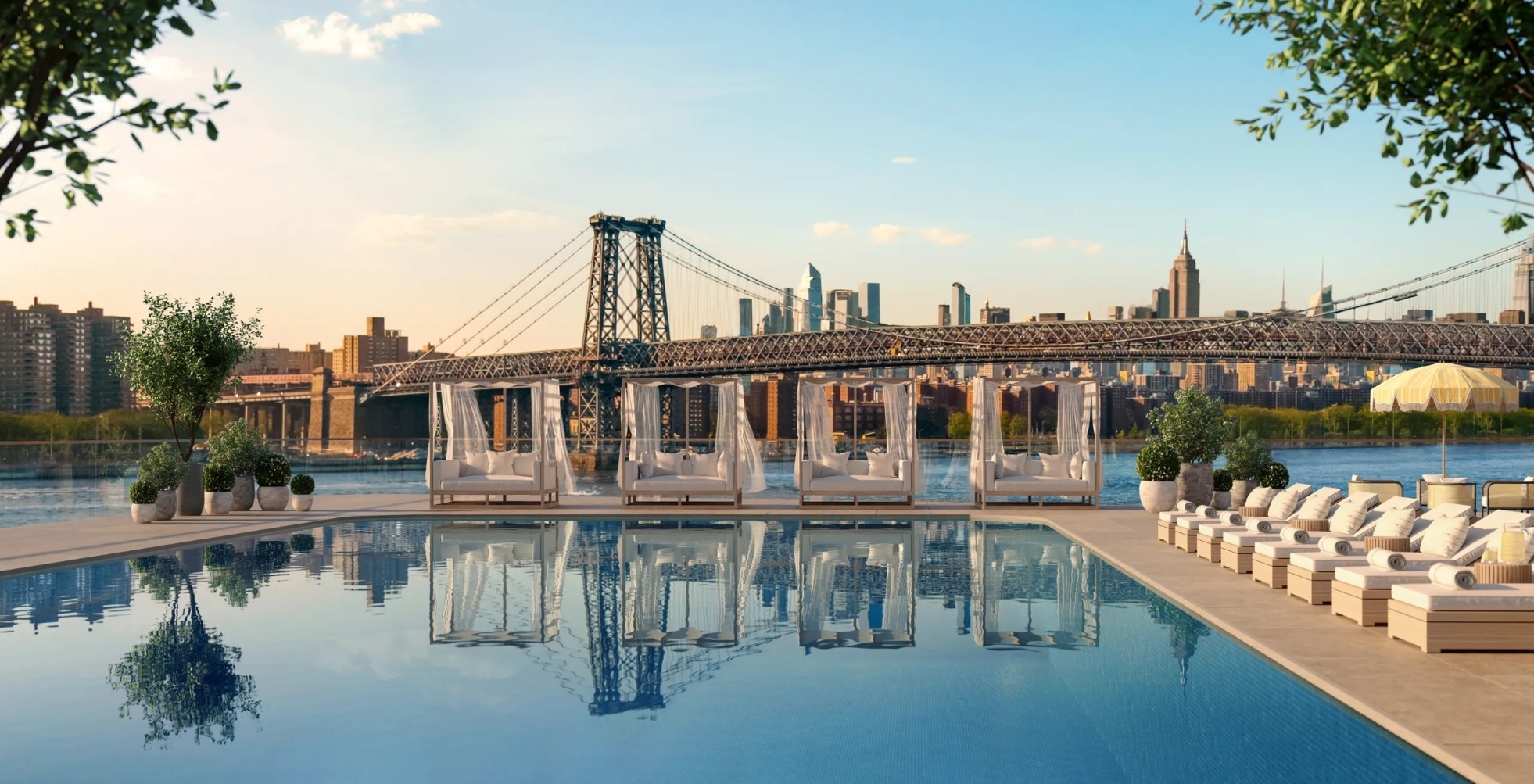 Rooftop pool with cabanas overlooking the Williamsburg Bridge and Manhattan skyline.