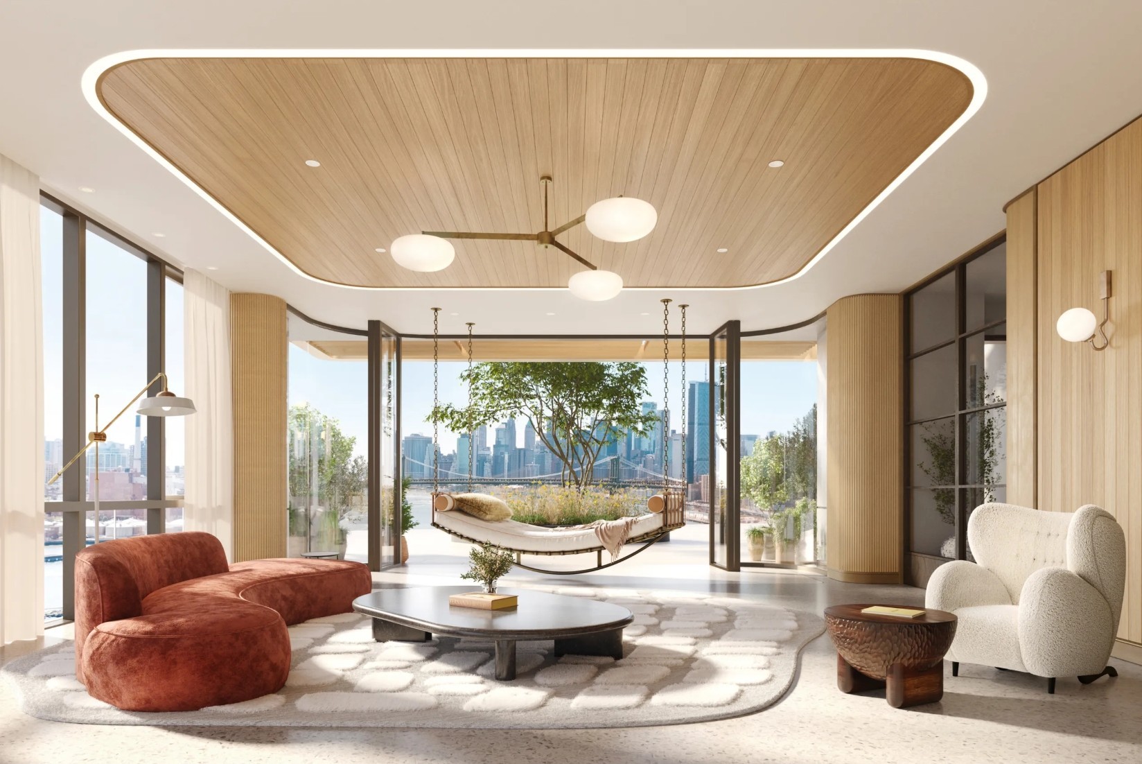 Living room with a wood-paneled ceiling, terrace daybed, and views of the river and Manhattan skyline.