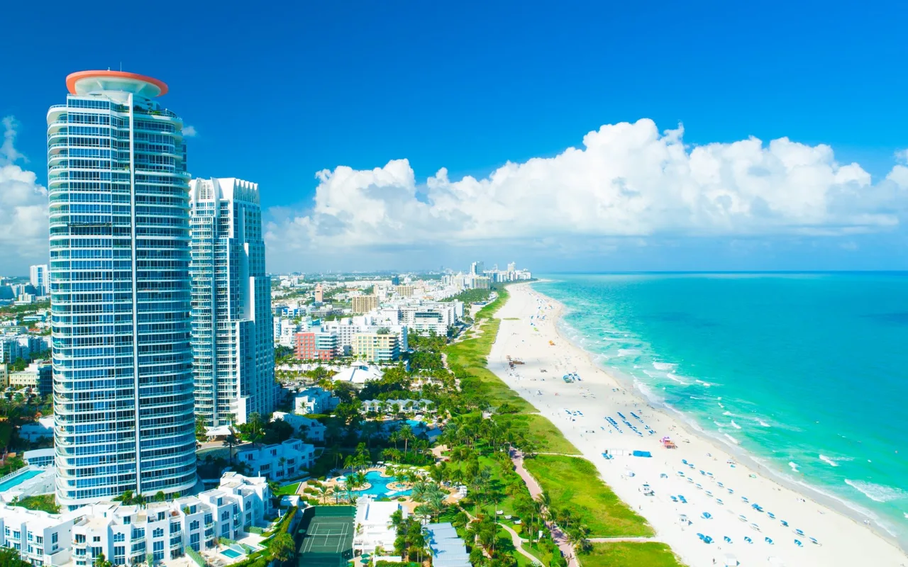 Aerial view of Miami Beach towers, park and Atlantic shoreline