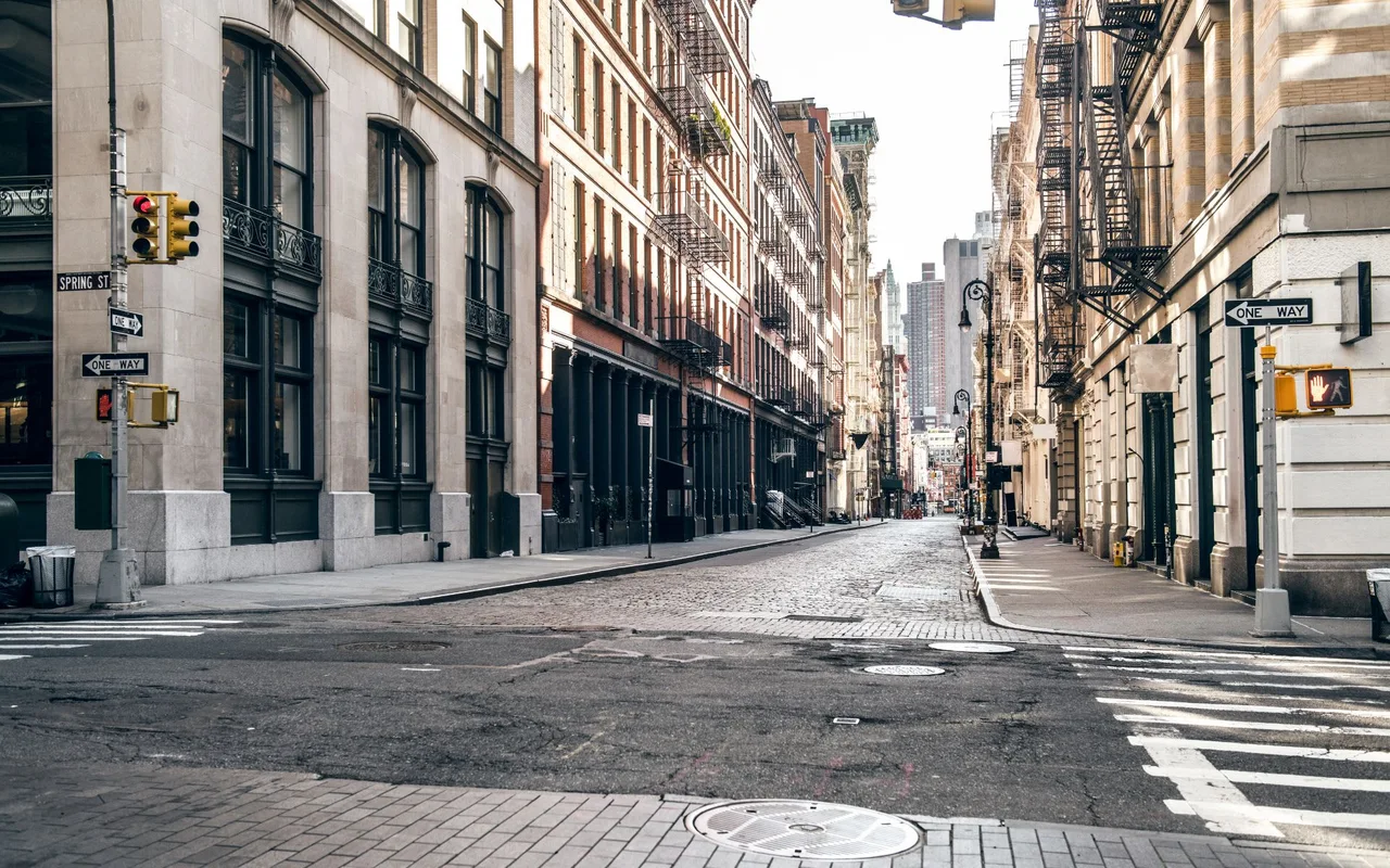 Cast-iron loft buildings on a cobblestone corner in SoHo, Manhattan