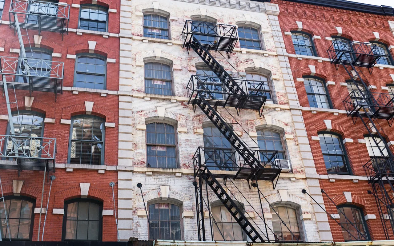 Brick loft facades with fire escapes in Tribeca, Manhattan
